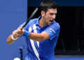 Djokovic advances in Vienna after tight Coric battle