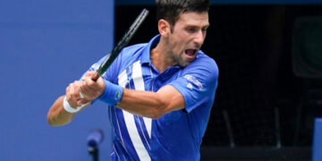 Djokovic advances in Vienna after tight Coric battle