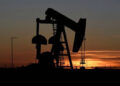 Oil falls as COVID-19 case surge stokes demand concerns