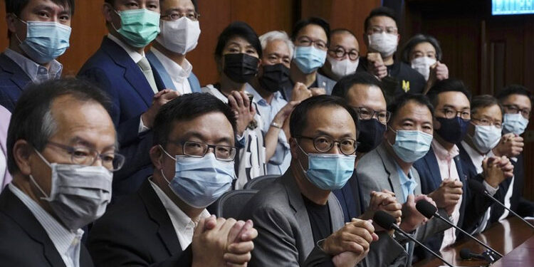 Hong Kong disqualifies four pro-democracy lawmakers